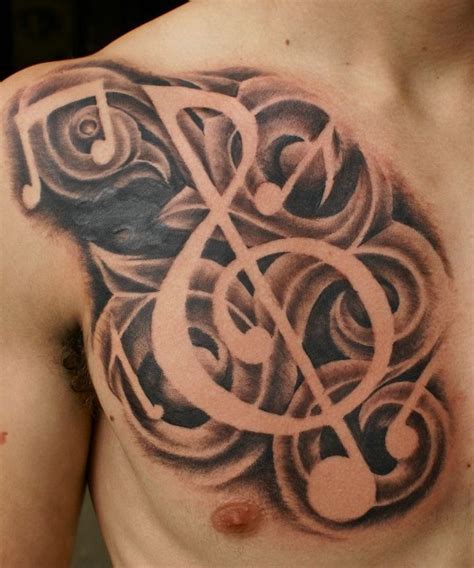 Tribal Music Tattoo On Men Chest Tattoo Designs Pattern Music