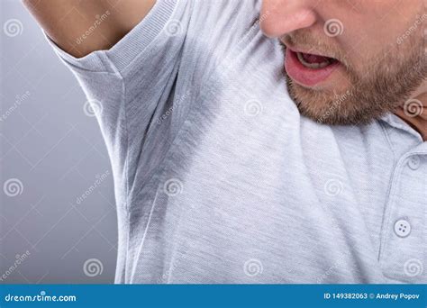 Man Looking At His Sweaty Armpit Stock Image Image Of Open Armpits