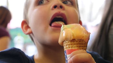 Boy Licks Colorful Ice Cream Cone Inside Ice Stock Footage Sbv
