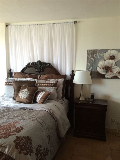 There are countless bedroom curtains on the market designed for every price range and style. Bedroom with sheer curtains behind bed. | Curtains behind ...