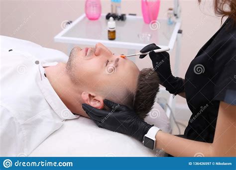 Cleaning The Face Of A Man In A Beauty Salon Stock Image Image Of