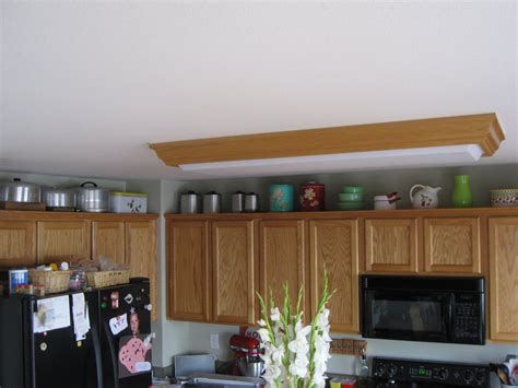 Custom cabinetry creates light and airy kitchen. Lady Goats: Decorating Above Kitchen Cabinets