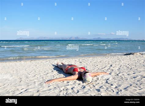Mid Adult Woman Sunbathing On Beach Alcudia Mallorca Spain Europe Stock Photo Royalty Free