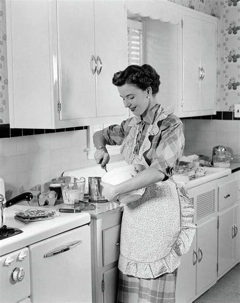 1950s woman housewife in kitchen apron by vintage images in 2020 vintage housewife 1950s