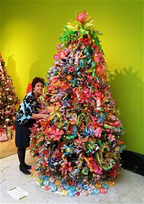 Need an extra prop for a costume or trying to decorate for a halloween or costume party? Tree decorated with Plastic Bottles | Recycled christmas ...