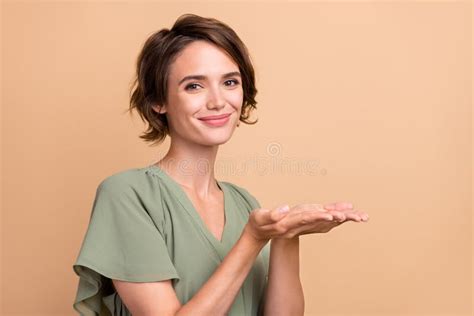 Photo Of Positive Reliable Lady Hands Presenting Empty Space Wear Green