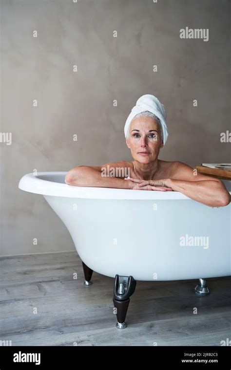 Mature Woman Relaxing In Bathtub Stock Photo Alamy