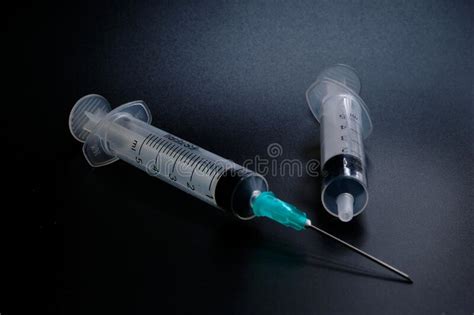 A Small Syringe Into Which A Hollow Sharp Pointed Bevel Cut Needle Is