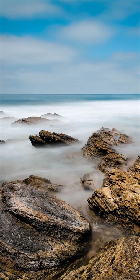 1080x2160 Coast Rocks Smog Seascape Wallpaper Landscape Wallpaper