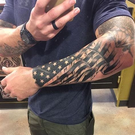 An upper sleeve tattoo of the american flag in full color. American flag sleeve tattoo American flag tattoos and ...