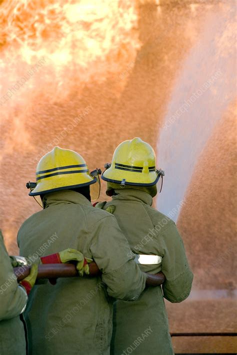 Firefighters Extinguishing A Fire Stock Image T6640286 Science Photo Library