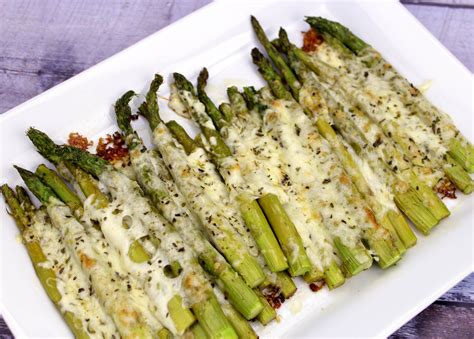 If you are trying to figure out how to cook asparagus in the oven, you will find this and roasted asparagus are both great. Cheesy Baked Asparagus Recipe | Just A Pinch Recipes