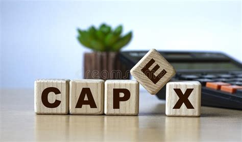 Capex The Word On The Cubes On The Background Of The Calculator And