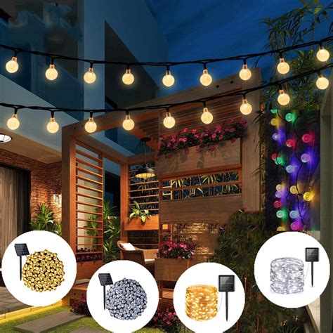 Indoor string lights hanging on a line in backyard. Solar String Lights, 7 meters 50 LED 8 Modes Outdoor ...