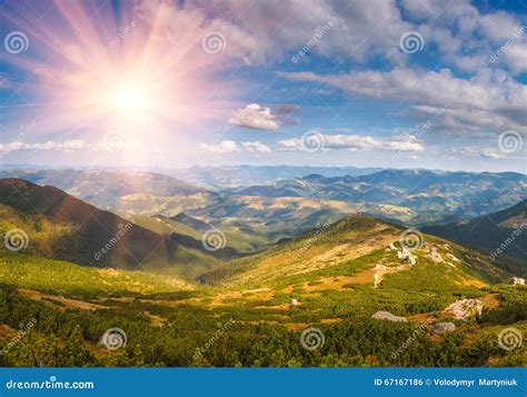 Beautiful Panoramic Landscape In The Mountains At Sunshine Stock Photo