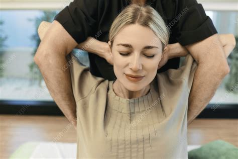 woman being stretched stock image f037 0965 science photo library
