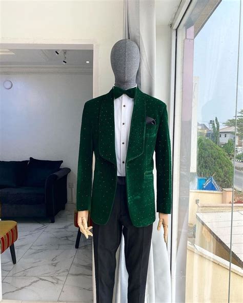 an emerald green velvet dinner shawl lapel tuxedo suit with black swarovski stone detailing