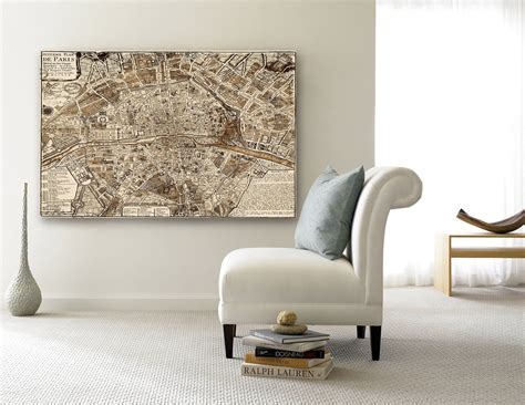 A Large Map Hangs On The Wall Above A White Chair In A Room With A Window