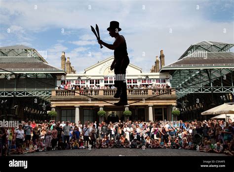 A Street Entertainer Performing In Covent Garden London England Uk
