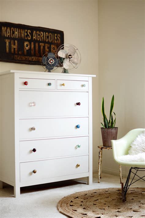Skip specialized nursery furniture by transforming a basic tarva dresser with some white paint and can you spot the second ikea hack? Try This: Mismatched Dresser Knobs - A Beautiful Mess
