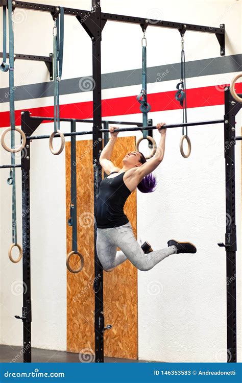 Fit Young Woman Doing Pull Ups On Rings Stock Image Image Of Rings