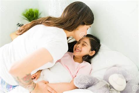 Good Night Mommy Mom Giving A Gentle Kiss Stock Photo Image Of