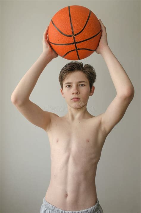 Teenager Boy Without A Shirt With A Ball For Basketball Stock Photo