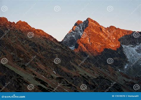 Last Sunrays On The Peak Of Mountain Stock Photo Image Of Orange