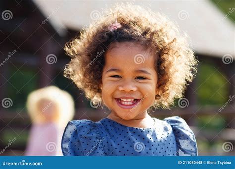 Outdoor Close Up Portrait Of A Cute Young Black Girl Smiling African