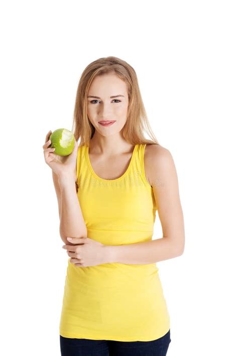 Beautiful Causal Caucasian Woman Holding Fresh Green Apple With Missing Bite Stock Image