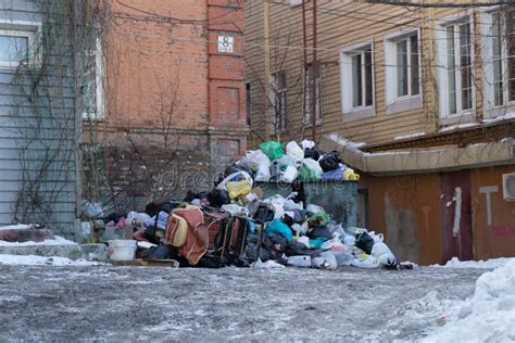 Urban Landscape With A Large Garbage Pile In The Yard Editorial Stock