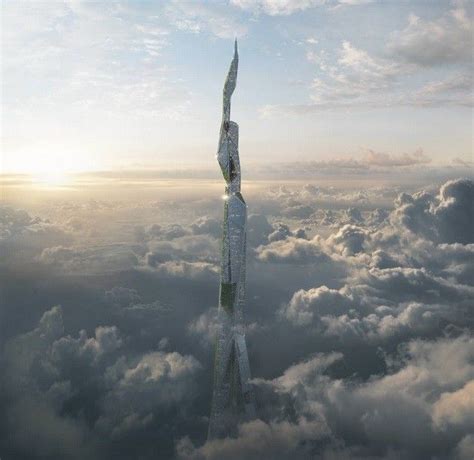 An Aerial View Of A Tall Building In The Clouds