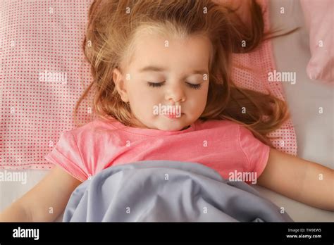 Cute Little Girl Sleeping In Bed At Home Stock Photo Alamy