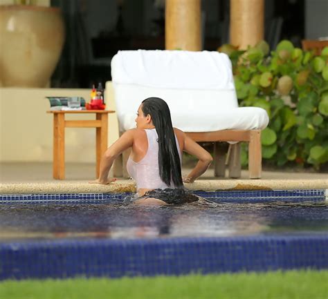 Kim Kardashian Shows Off Her Huge Boobs In A Wet Seethru Top Poolside