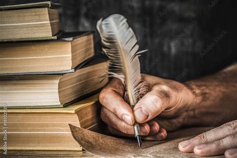 Man Writing An Old Letter Old Quill Pen Books And Papyrus Scroll On