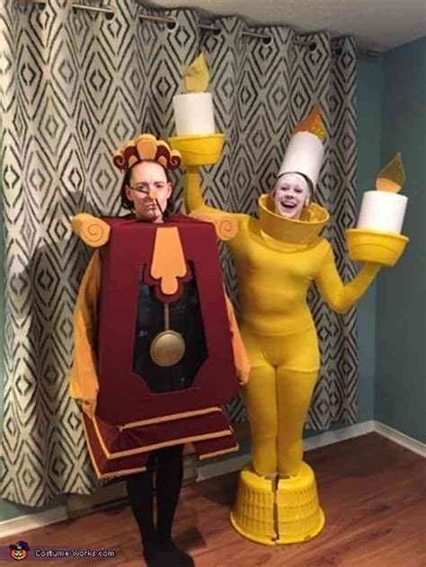 Two People In Costumes Standing Next To Each Other