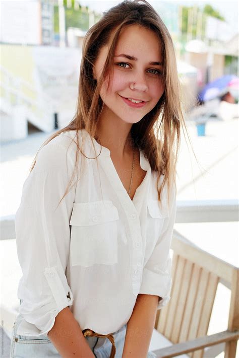 Portrait Of Pretty Young Smiling Woman Outdoor In Summer By Stocksy Contributor Viktor