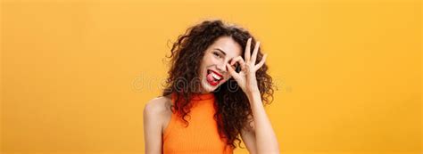 Carefree Optimistic And Energized Good Looking Woman With Curly