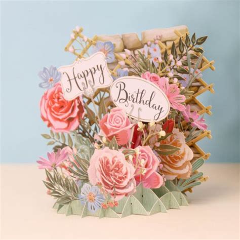 Have friends and family spell out a birthday message by having each person hold up a sign with one letter or word on it. Me & McQ "Happy Birthday Flowers" 3D Card | Temptation Gifts