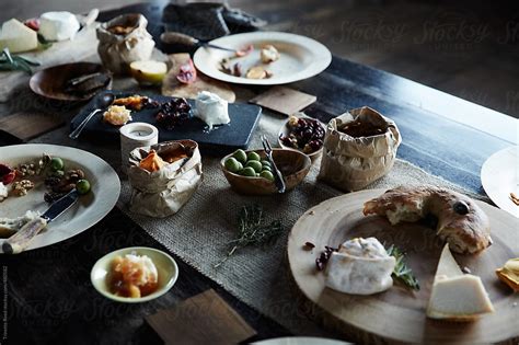 Picnic Food On Wood Table After Dinner Party By Stocksy Contributor
