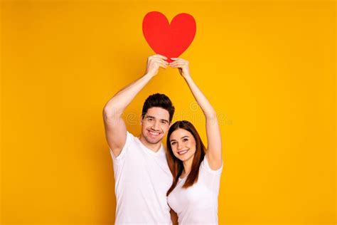 close up photo two beautiful people she her he him his guy lady hold hands arms heart shape form