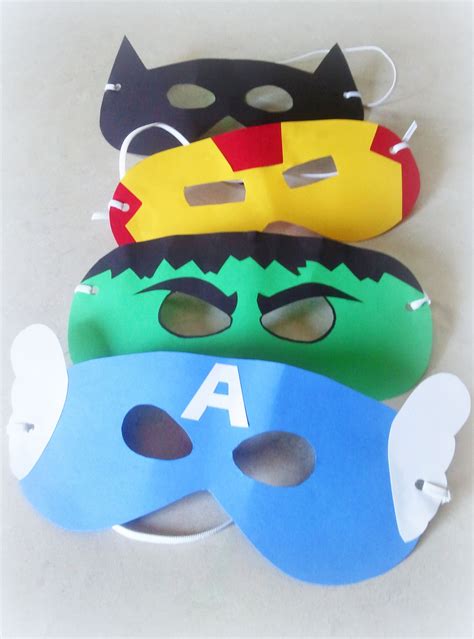 Three Masks With Different Designs On Them Sitting Next To Each Other