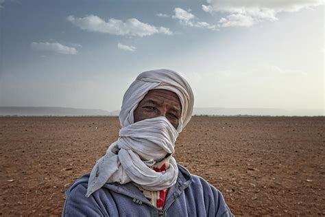 An Unidentified Bedouin Man Wears Traditional Clothing In Sahara