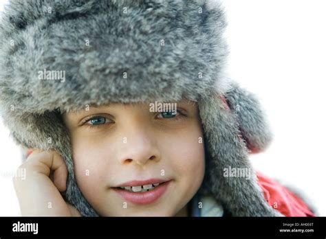 Boy Wearing Fur Hat Smiling At Camera Close Up Stock Photo Alamy