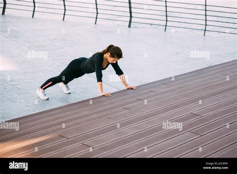 Beautiful Fitness Woman Doing Push Ups During Outdoor Training Workout