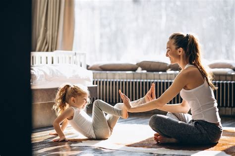 Premium Photo Mother And Daughter Yoga At Home
