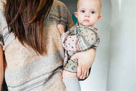 Woman Holding Baby Girl On Her Hip By Stocksy Contributor Pink House