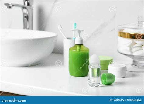 Roll On Deodorant And Toiletry On Countertop In Bathroom Stock Photo