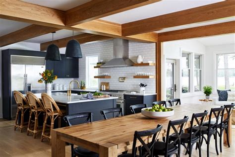 Open Concept Living Space Features A Modern Kitchen With Exposed Beams