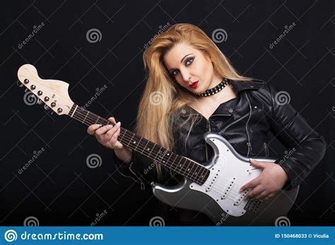 Beautiful Blonde Girl Playing Guitar In Rock Style On A Black Background Stock Image Image Of